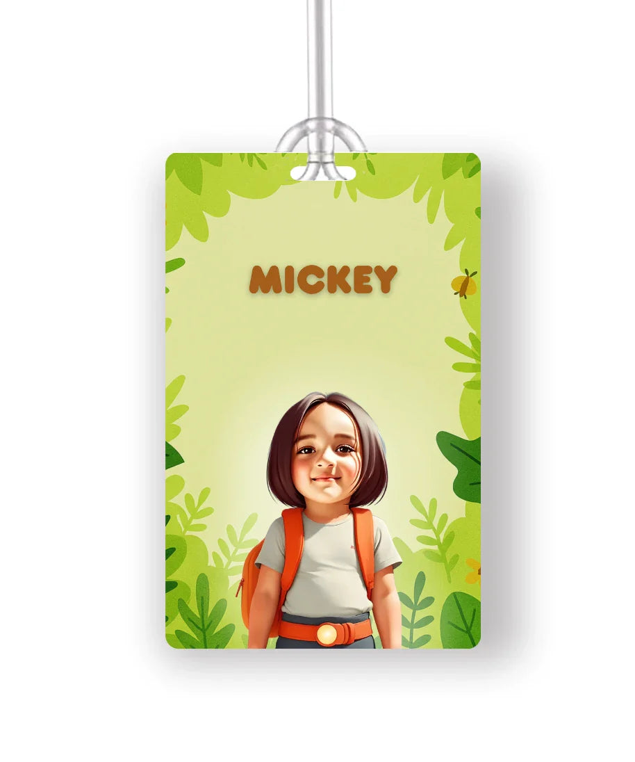 Personalised school bag tag with cartoon photo of girl wearing grey t-shirt and orange backpack on green forest theme background