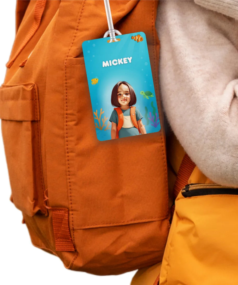 Personalised school bag tag for kids with name Mickey attached to orange backpack
